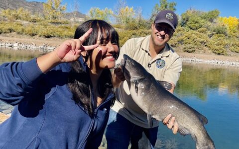 A STRIVE student catching a fish at Lake Lehow!