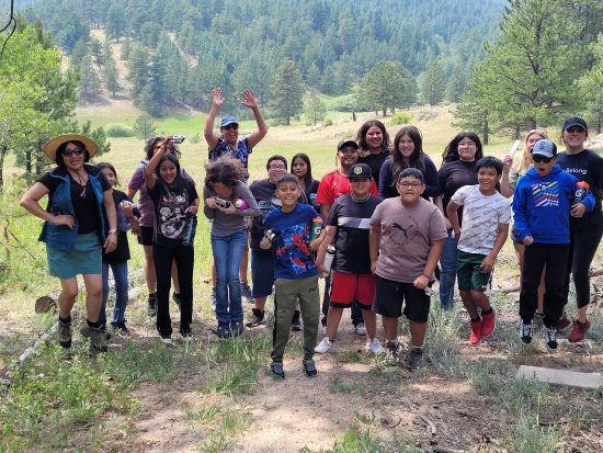 The Longmont Youth Center Overnight Camping Program group poses for a picture