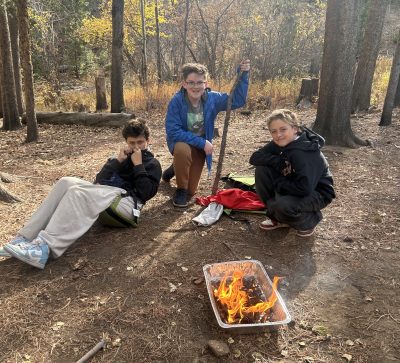 Students building connections while fire building